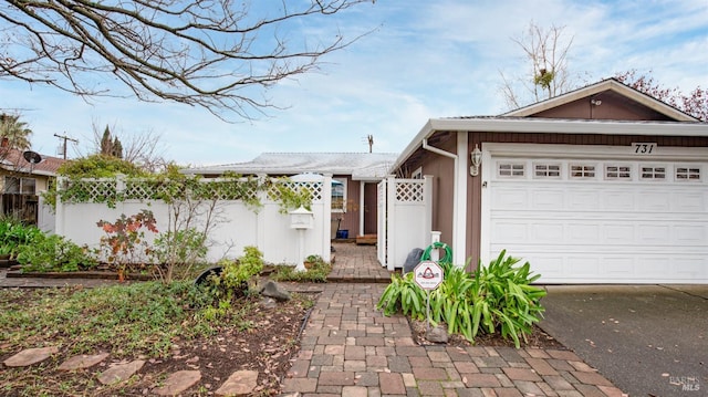 view of front of property featuring a garage