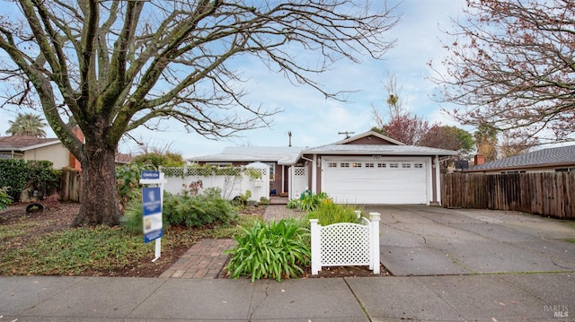 ranch-style home featuring a garage