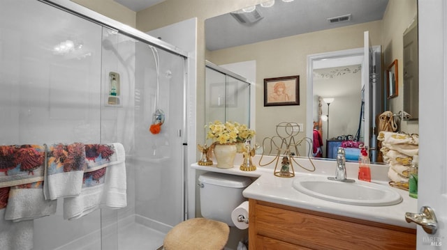 bathroom with vanity and a shower with shower door