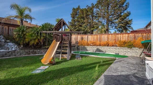 view of play area featuring a yard