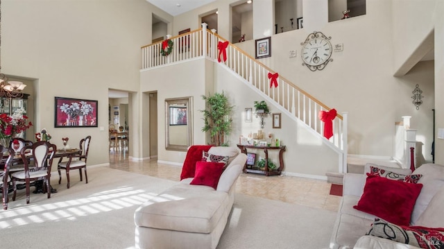 carpeted living room featuring a high ceiling