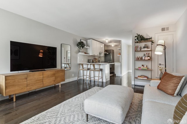 living room featuring dark hardwood / wood-style flooring