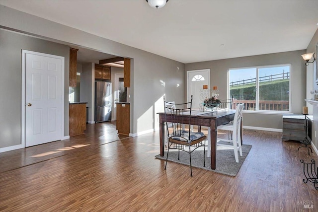 dining room featuring dark hardwood / wood-style flooring