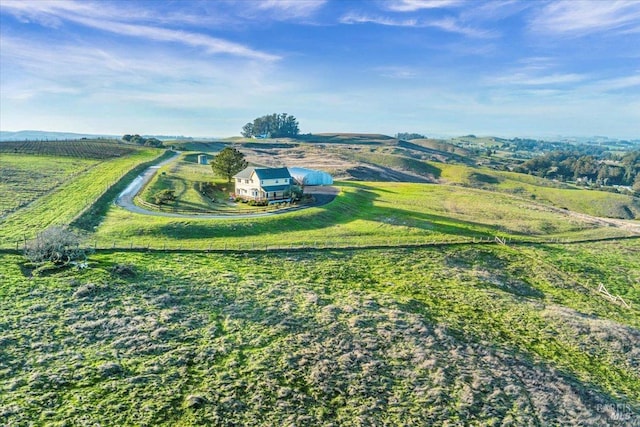 birds eye view of property featuring a rural view