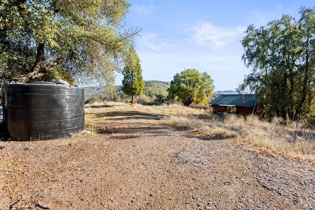 view of yard with a rural view