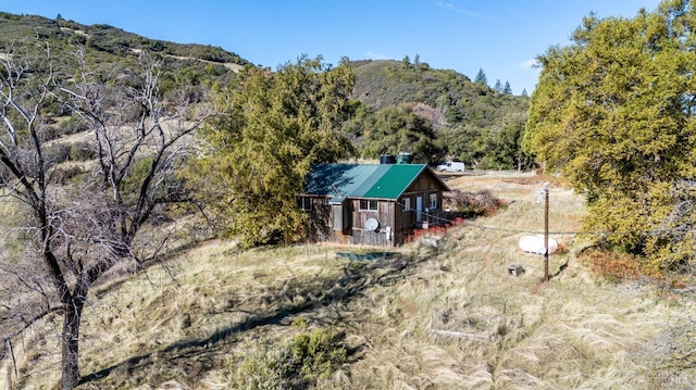 birds eye view of property with a mountain view