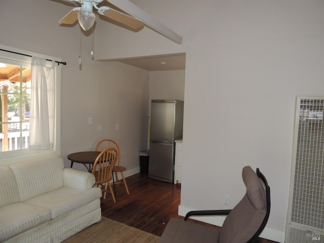 living room featuring ceiling fan and dark wood-type flooring