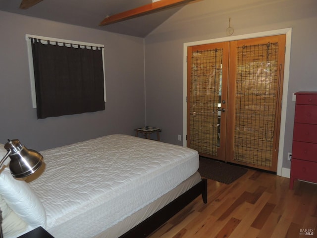 bedroom with hardwood / wood-style flooring