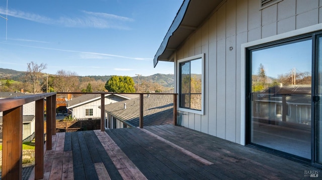 wooden terrace featuring a mountain view