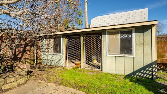 view of property exterior featuring an outbuilding