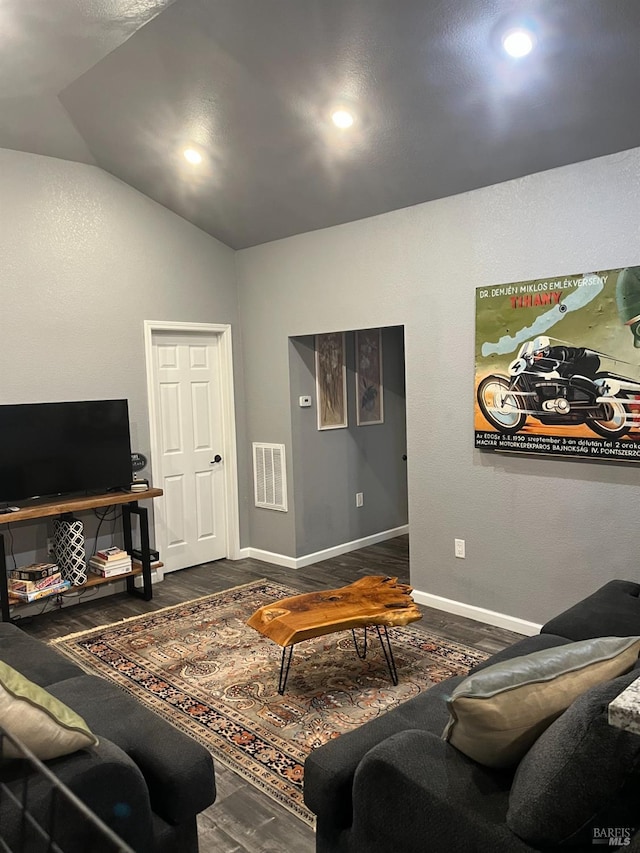 living room featuring dark hardwood / wood-style floors and high vaulted ceiling