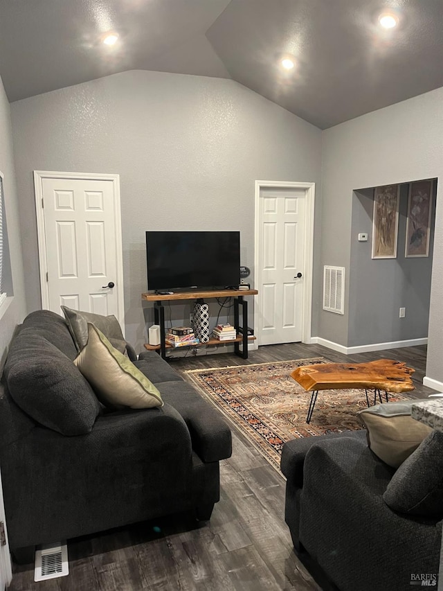 living room with wood-type flooring and vaulted ceiling