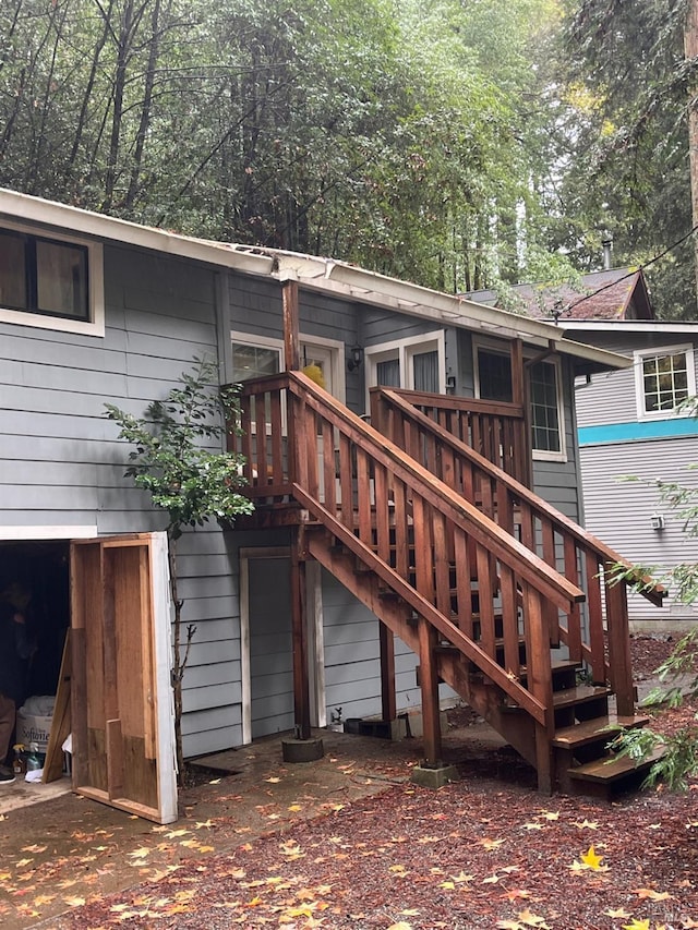 back of property featuring a wooden deck