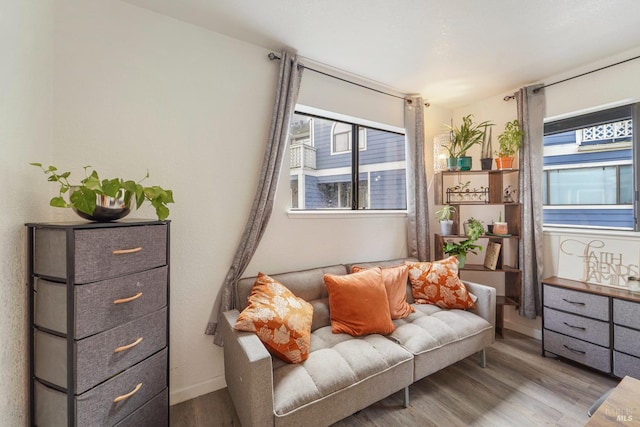 sitting room with light wood finished floors and baseboards