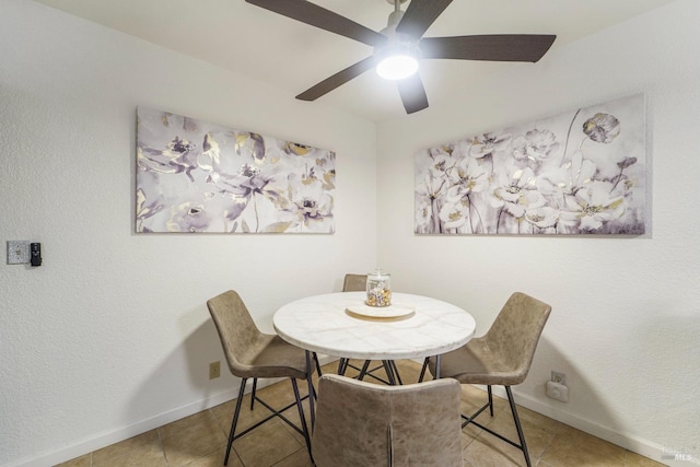 dining room with light tile patterned floors and baseboards