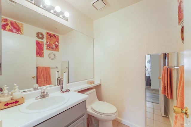 bathroom featuring toilet, visible vents, vanity, and tile patterned floors