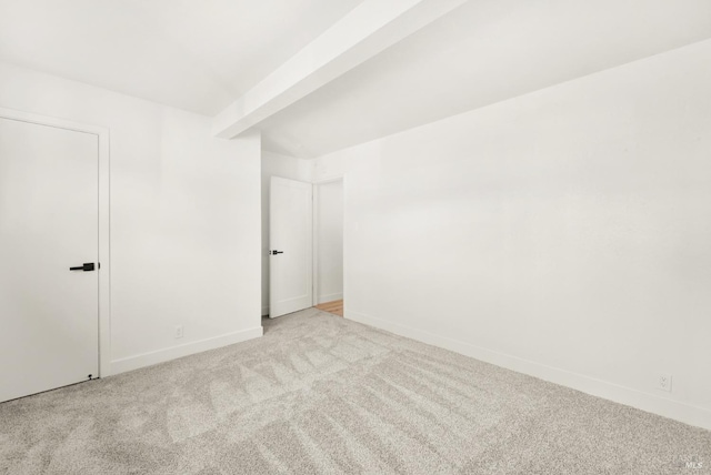 empty room with light colored carpet