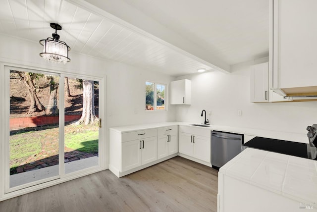 kitchen featuring appliances with stainless steel finishes, pendant lighting, beam ceiling, light hardwood / wood-style floors, and white cabinets