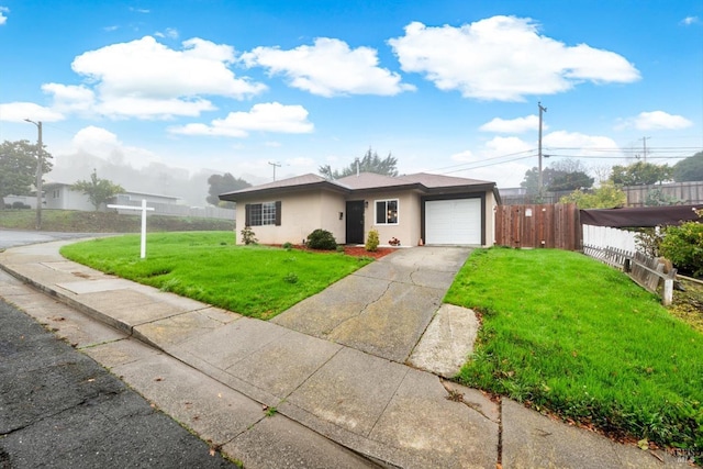 view of front of home featuring a front lawn and a garage