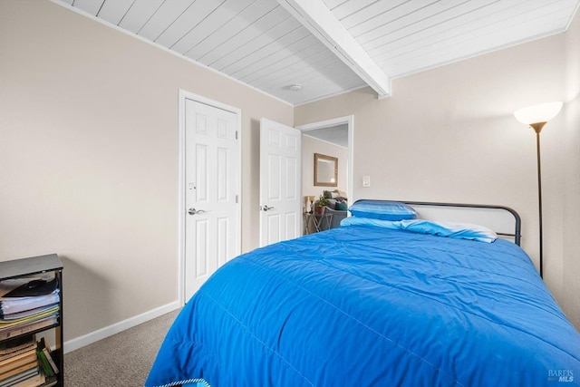 bedroom with carpet and beamed ceiling