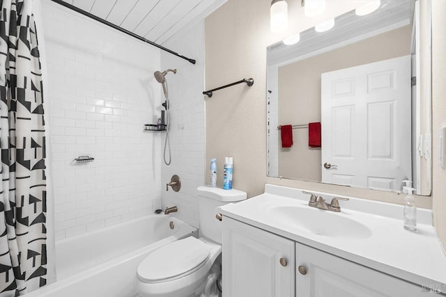 full bathroom featuring shower / bath combo with shower curtain, toilet, and vanity