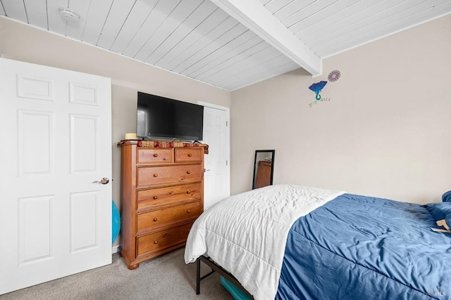 bedroom featuring wood ceiling, carpet, and beamed ceiling