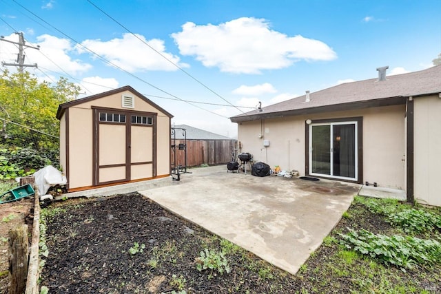 view of patio / terrace featuring a shed