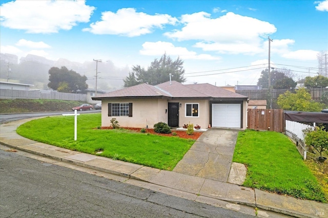 single story home featuring a front lawn and a garage