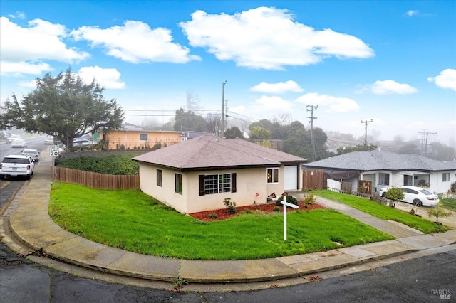 ranch-style home with a front yard