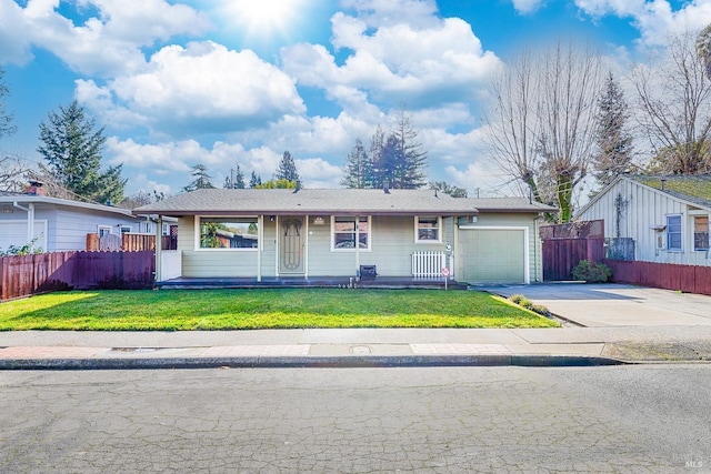 ranch-style home with a front lawn and a garage