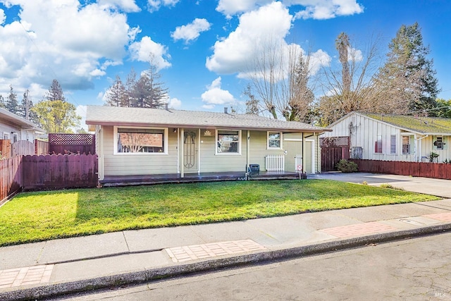 single story home with a porch and a front lawn