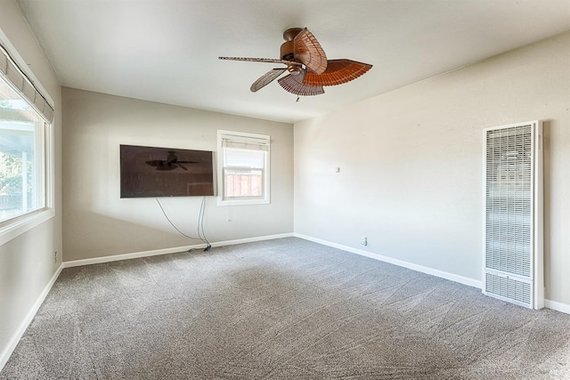 unfurnished room with carpet flooring and ceiling fan