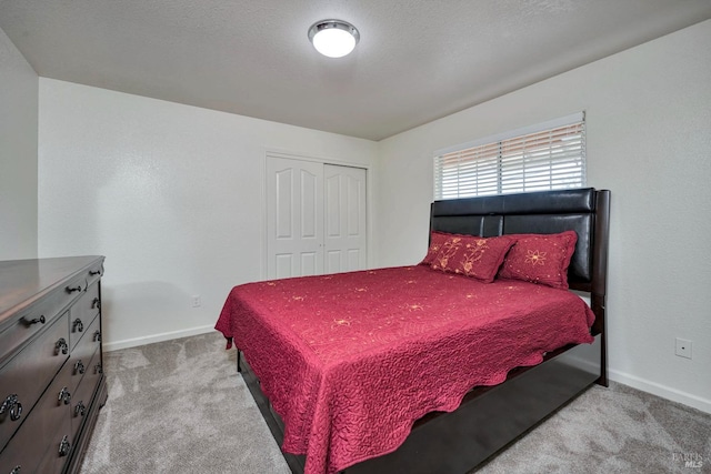 carpeted bedroom featuring a closet