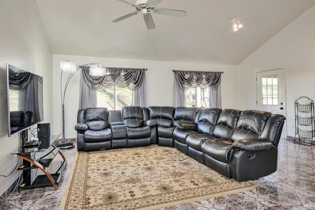 living room featuring plenty of natural light, ceiling fan, and lofted ceiling