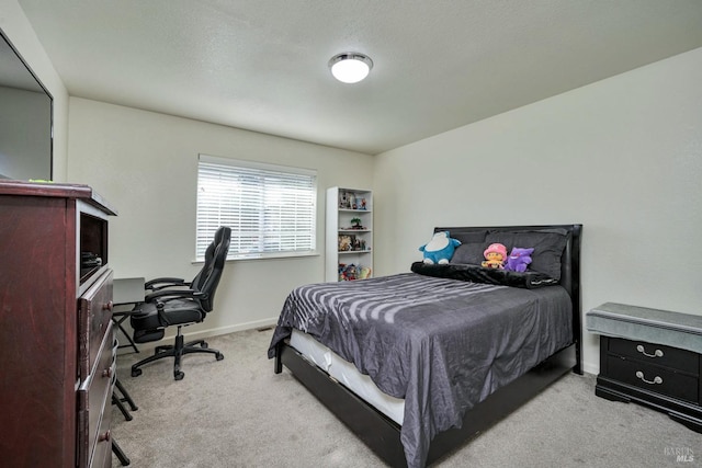 bedroom with light colored carpet