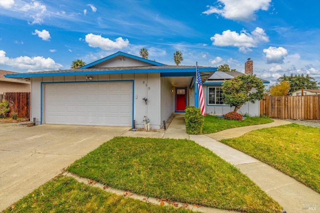 ranch-style home featuring a front lawn and a garage