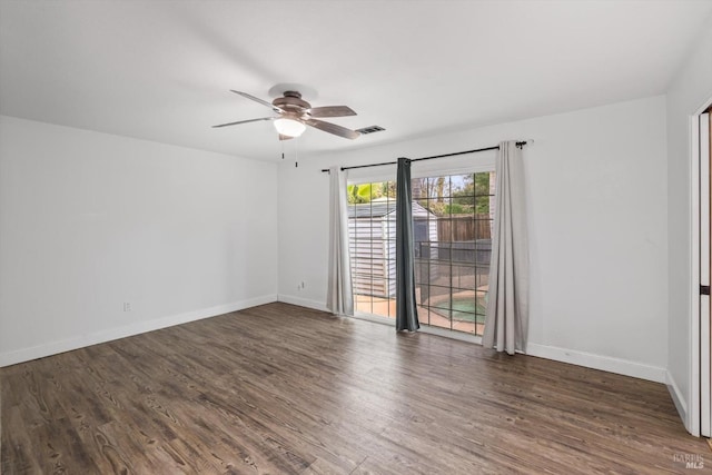 empty room featuring dark hardwood / wood-style floors and ceiling fan