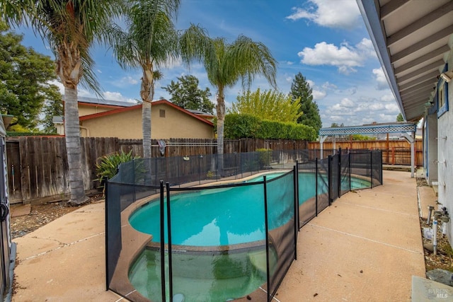 view of swimming pool with a patio area