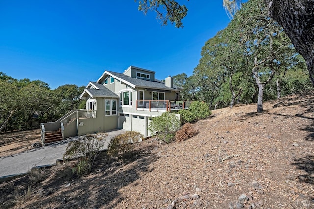 view of front of house with a porch and a garage