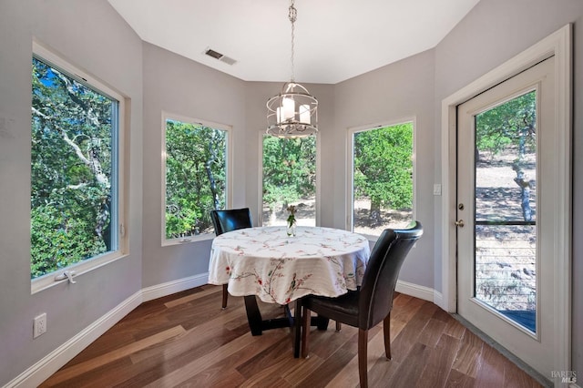 dining area featuring a chandelier and hardwood / wood-style floors