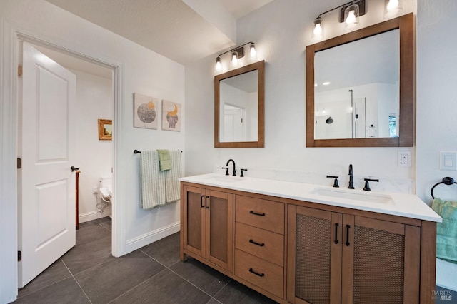 bathroom with tile patterned floors, vanity, and toilet