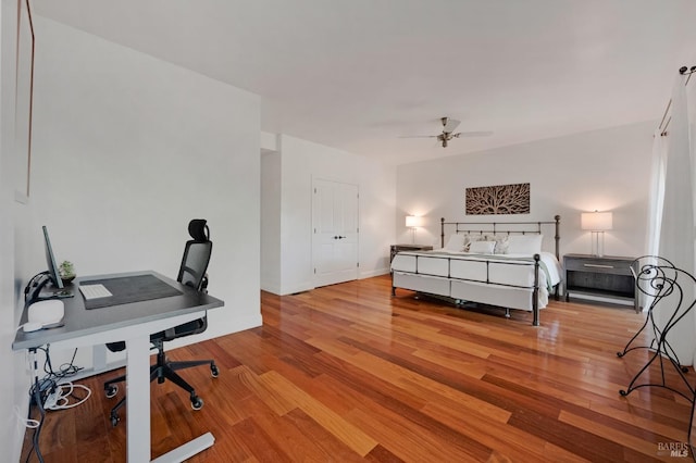 bedroom featuring light hardwood / wood-style floors and ceiling fan