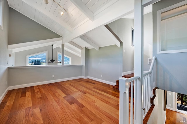 additional living space featuring vaulted ceiling with beams, wooden ceiling, and light hardwood / wood-style flooring