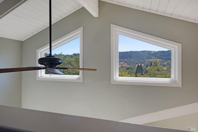 room details featuring beamed ceiling and a mountain view