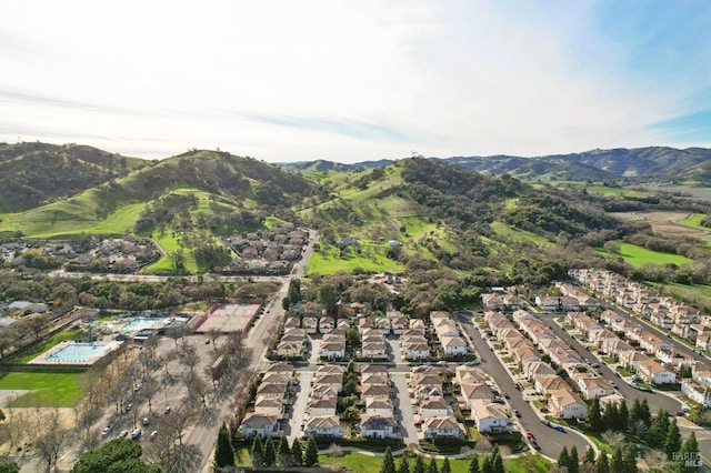 birds eye view of property featuring a mountain view