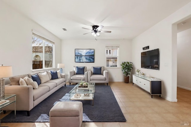 tiled living room with ceiling fan