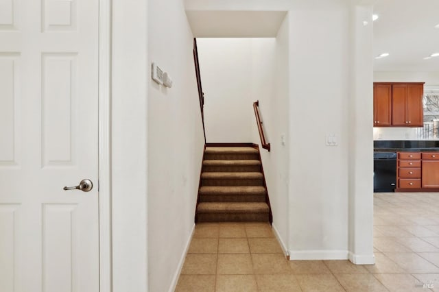 stairs featuring tile patterned floors