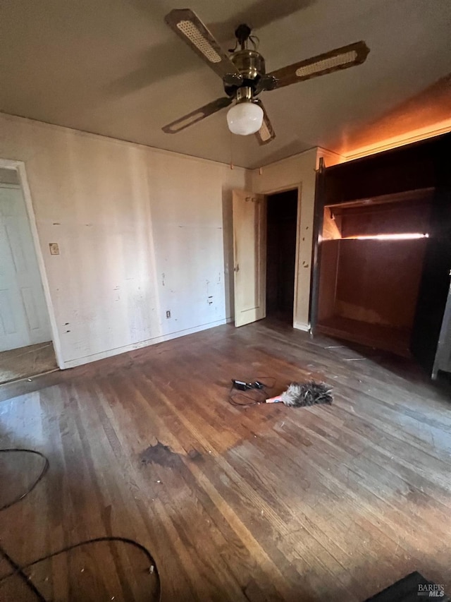 unfurnished bedroom featuring ceiling fan and wood-type flooring