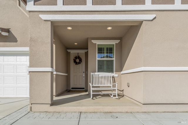 entrance to property featuring a garage