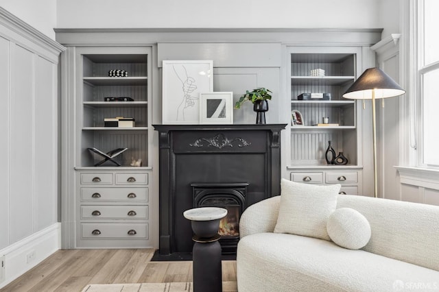 living area with light hardwood / wood-style floors